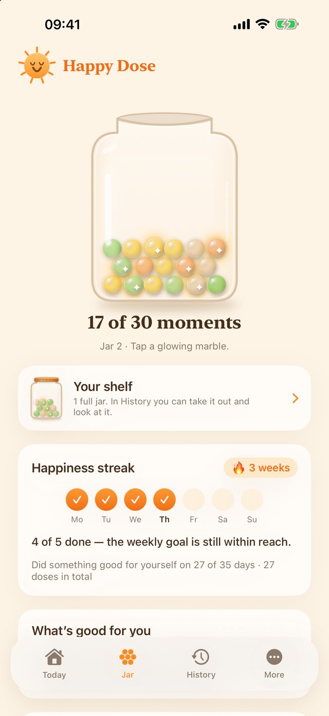 The happiness jar with seventeen of thirty colorful marbles, and the shelf with a full jar below.